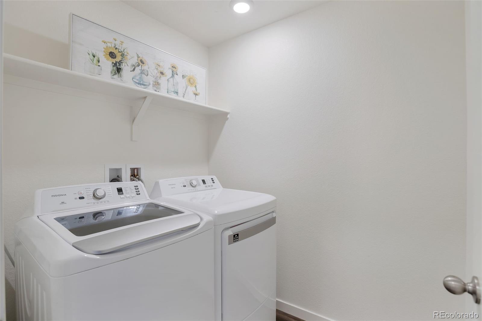 7017 Kali Court Frederick, CO 80530 - Photo 13 of 15 a utility room with dryer and washer