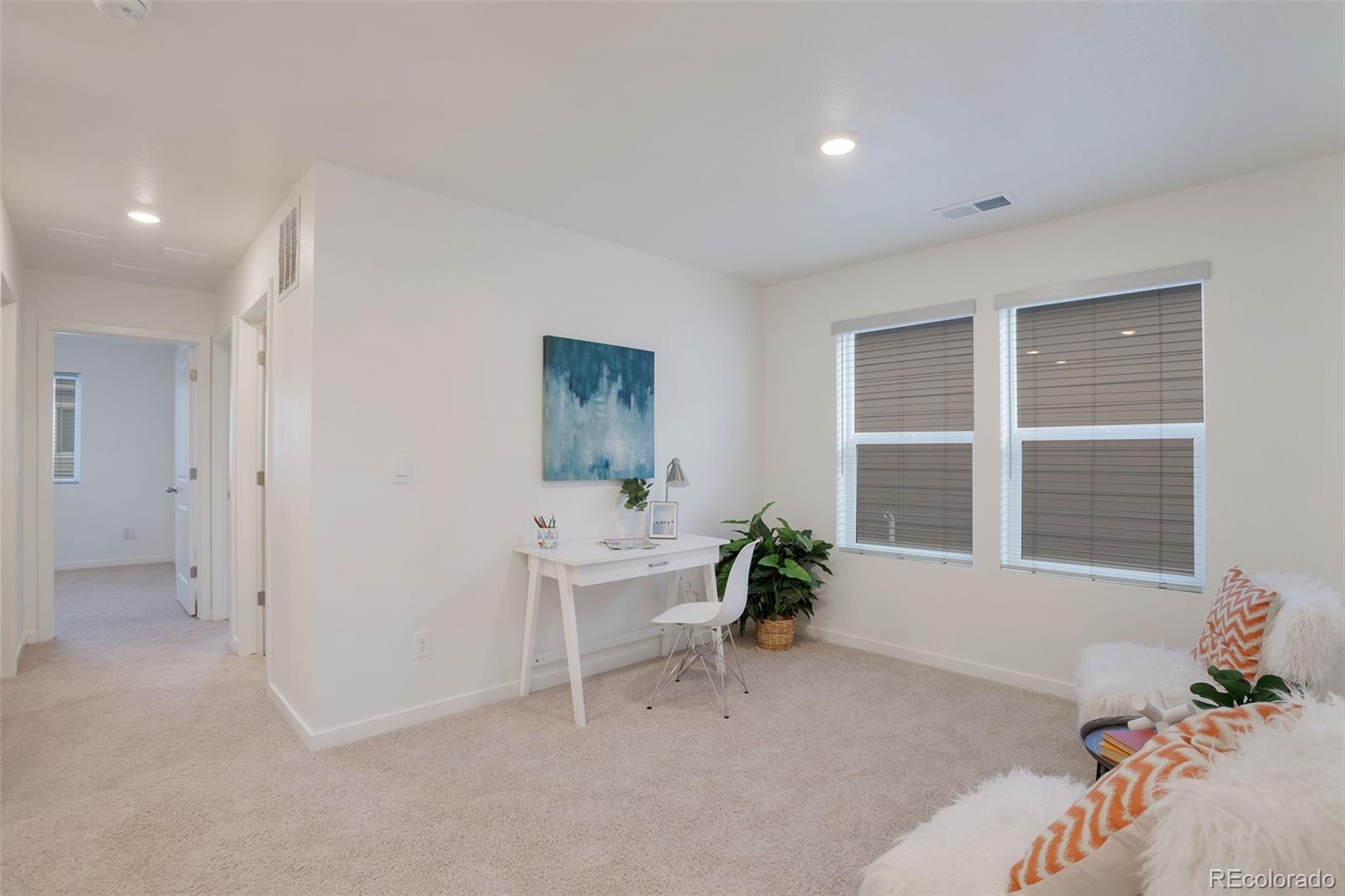 7017 Kali Court Frederick, CO 80530 - Photo 6 of 15 a living room with furniture and windows
