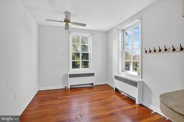 a view of a livingroom with a fireplace and window