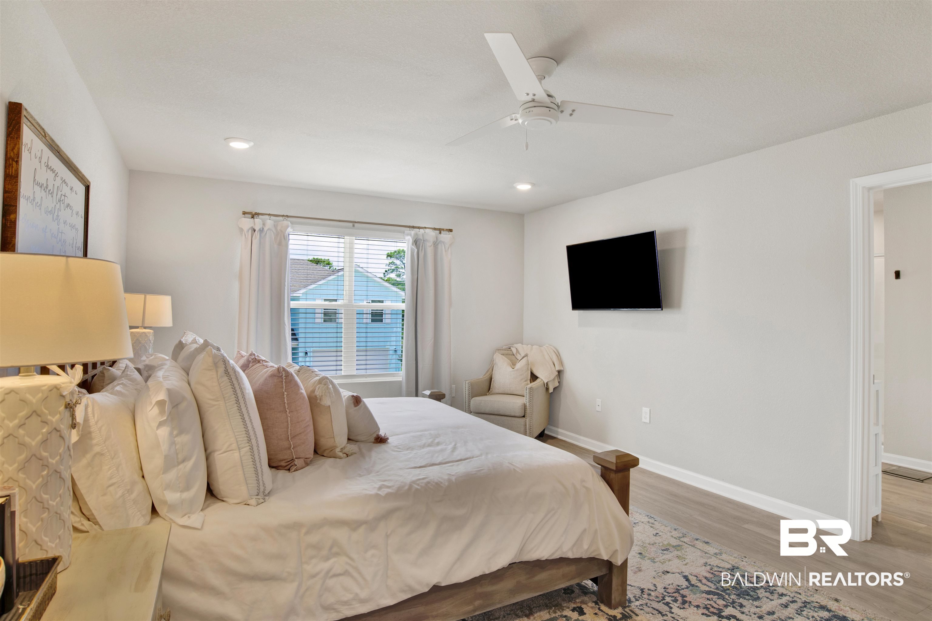 24532 Broken Sound Loop Orange Beach, AL 36561 - Photo 17 of 29 Bedroom featuring ceiling fan and hardwood / wood-style floors