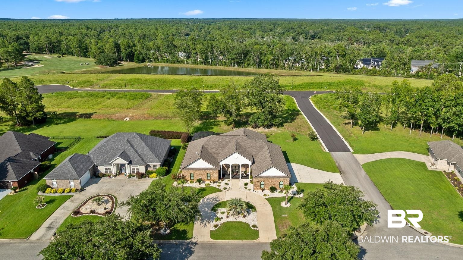 23357 Carnoustie Drive Foley, AL 36535 - Photo 2 of 99 Drone / aerial view of a nearby body of water and a forest