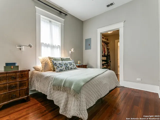 a bathroom with a toilet a sink and a window