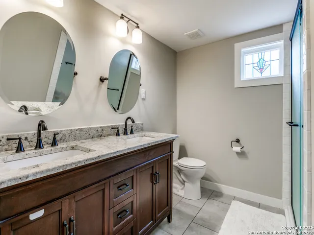 a view of a hallway with wooden floor and furniture