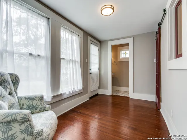 a kitchen with granite countertop a sink stove and refrigerator