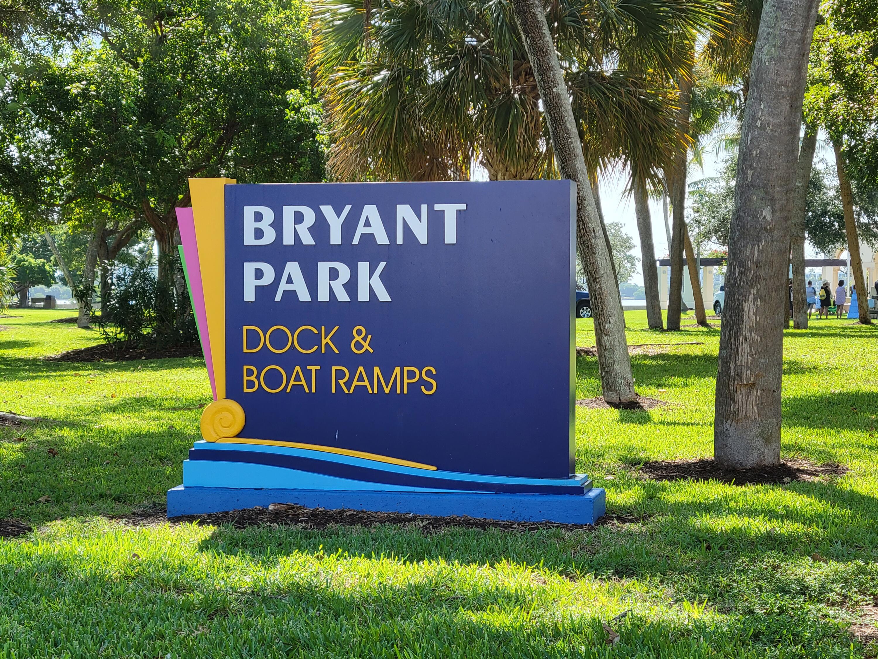 101 South Golfview Road, Unit 11 Lake Worth Beach, FL 33460 - Photo 25 of 28 a sign that is sitting on a lush green field