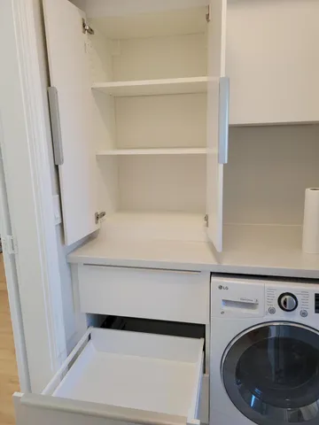 a utility room with washing machine
