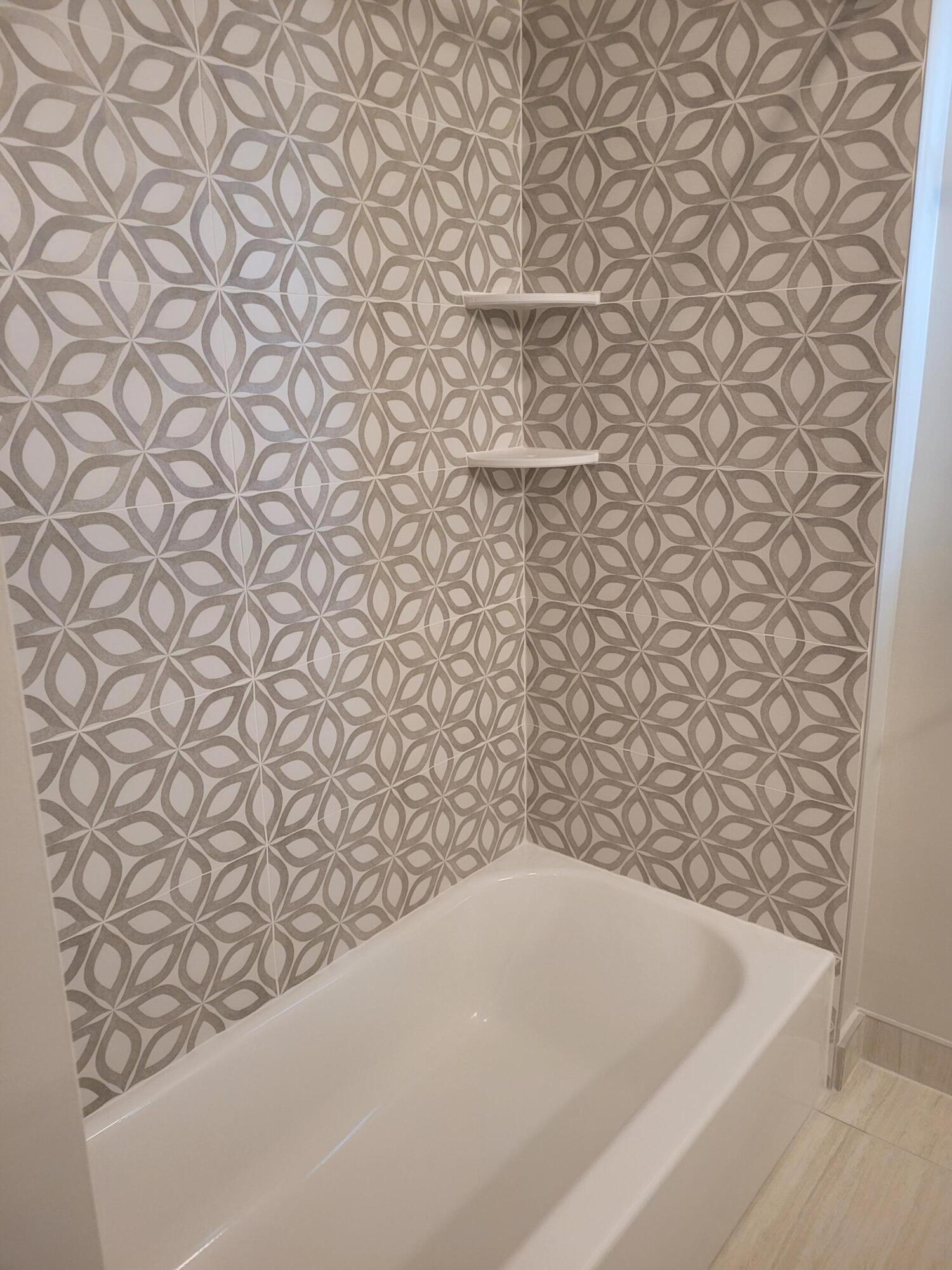 101 South Golfview Road, Unit 11 Lake Worth Beach, FL 33460 - Photo 8 of 28 a bathroom with a bathtub and a shower