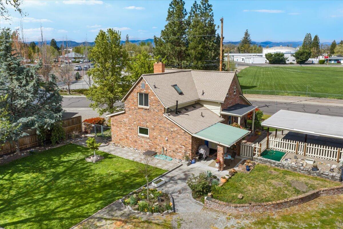 440 Bush Street Central Point, OR 97502 - Photo 32 of 40 an aerial view of a house with garden space and street view