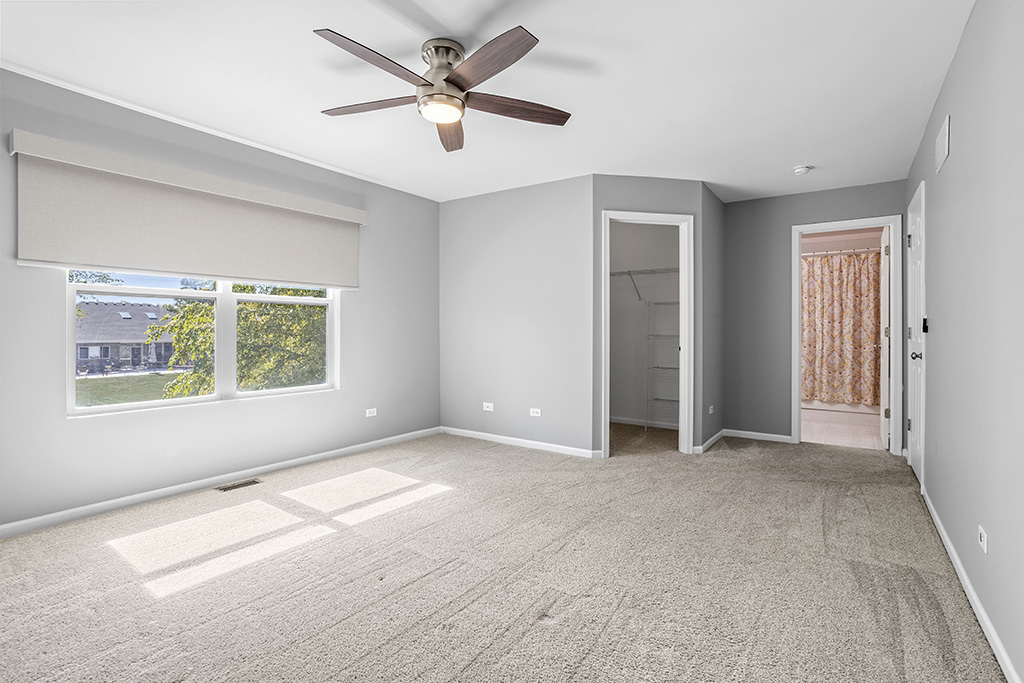 6506 Roth Drive Joliet, IL 60431 - Photo 13 of 24 an empty room with windows and fan