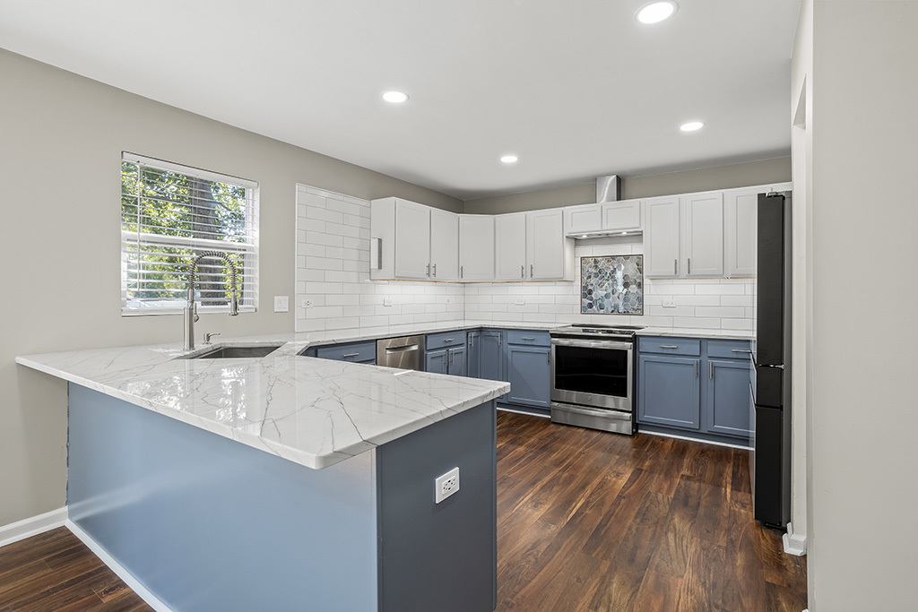 6506 Roth Drive Joliet, IL 60431 - Photo 2 of 24 a kitchen with a sink window and cabinets