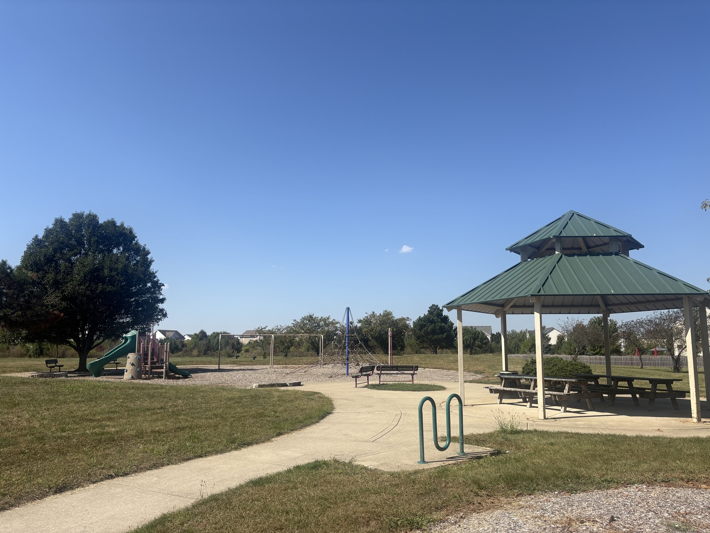 6506 Roth Drive Joliet, IL 60431 - Photo 23 of 24 a view of a swimming pool with lawn chairs under an umbrella