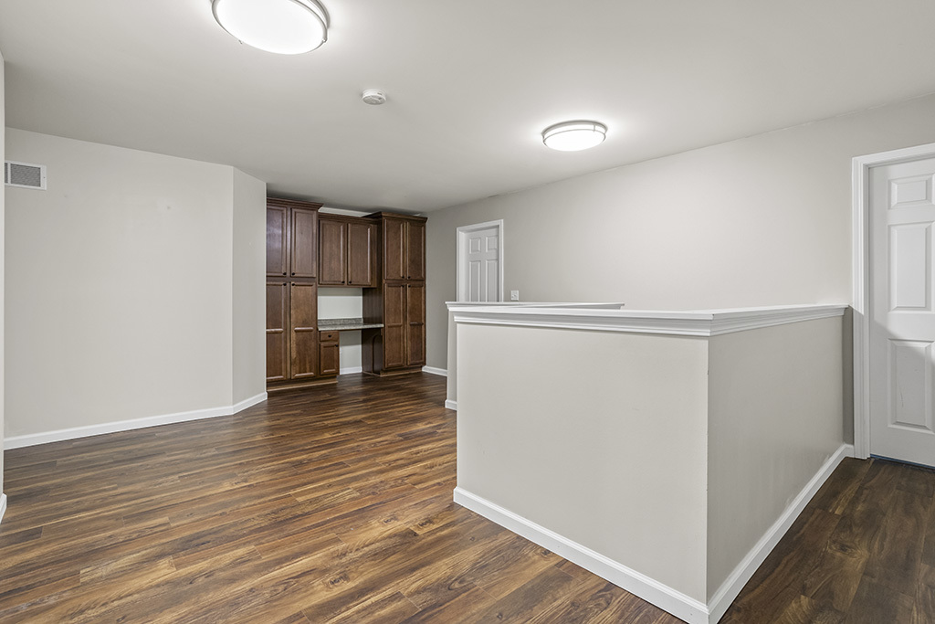 6506 Roth Drive Joliet, IL 60431 - Photo 9 of 24 a view of a kitchen with wooden floor and a refrigerator