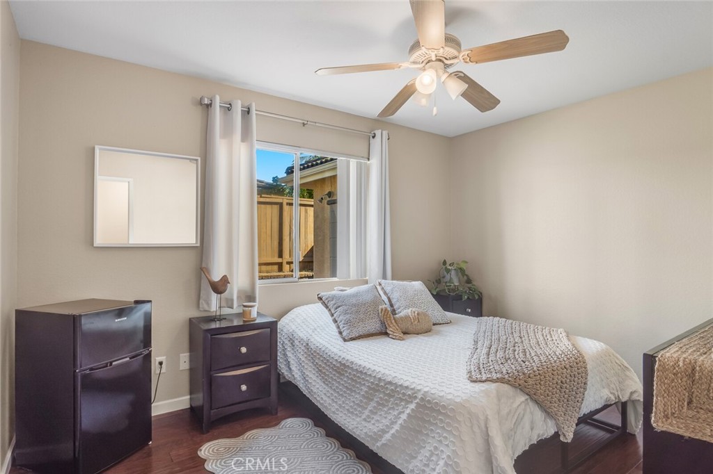 4330 Forest Ranch Way Oceanside, CA 92057 - Photo 17 of 51 The private bedroom downstairs features a large window, ceiling fan and easy access to a full bathroom.