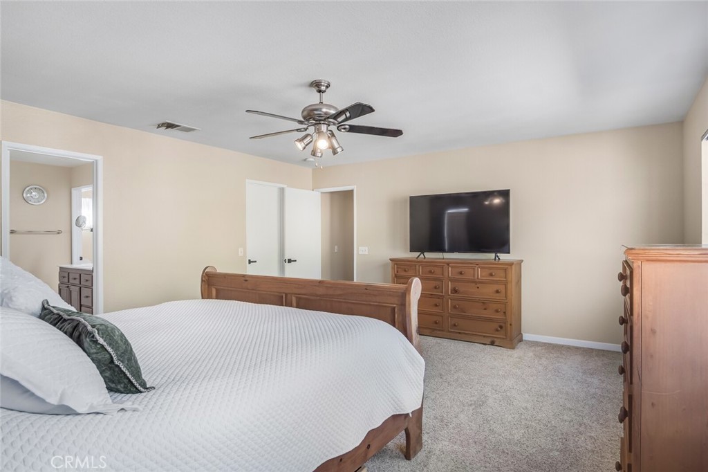 4330 Forest Ranch Way Oceanside, CA 92057 - Photo 23 of 51 Its spacious design invites relaxation with soft neutral tones and plush carpeting underfoot.