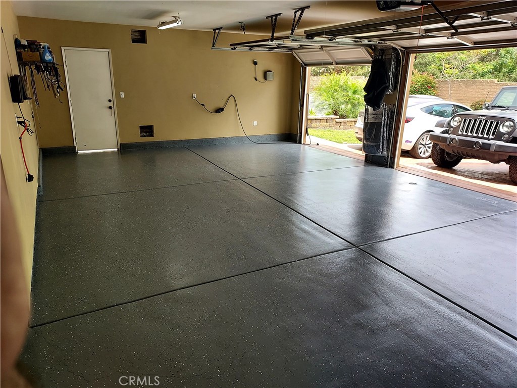 4330 Forest Ranch Way Oceanside, CA 92057 - Photo 37 of 51 The three-car garage offers generous space for parking, storage, and organization, making it as practical as it is polished