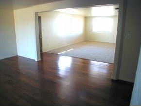 550 Ranch House Road Paulden, AZ 86334 - Photo 6 of 9 an empty room with wooden floor and windows