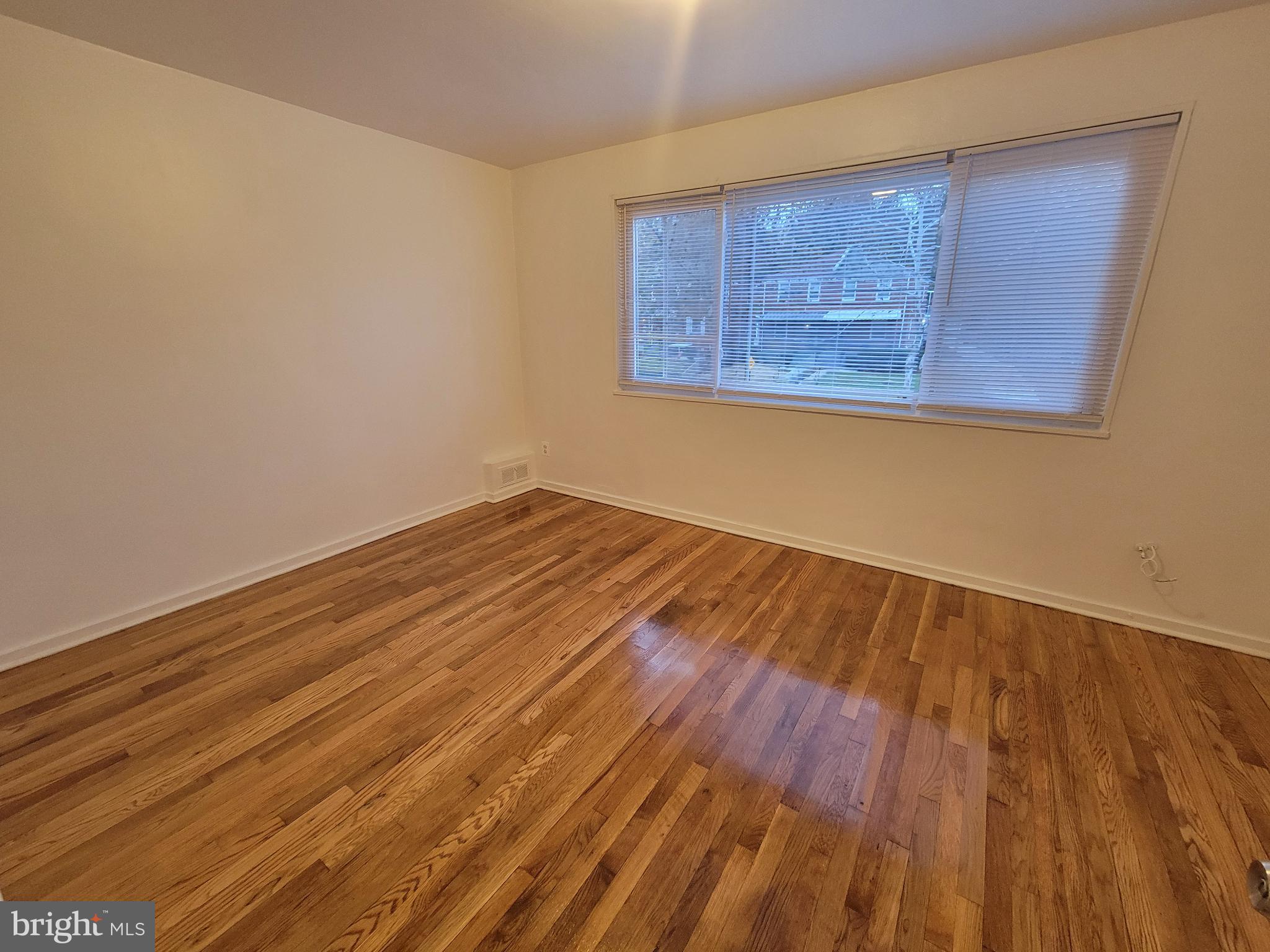 147 Mississippi Avenue Southeast Washington, DC 20032 - Photo 11 of 11 Primary Bedroom with hardwood floors.
