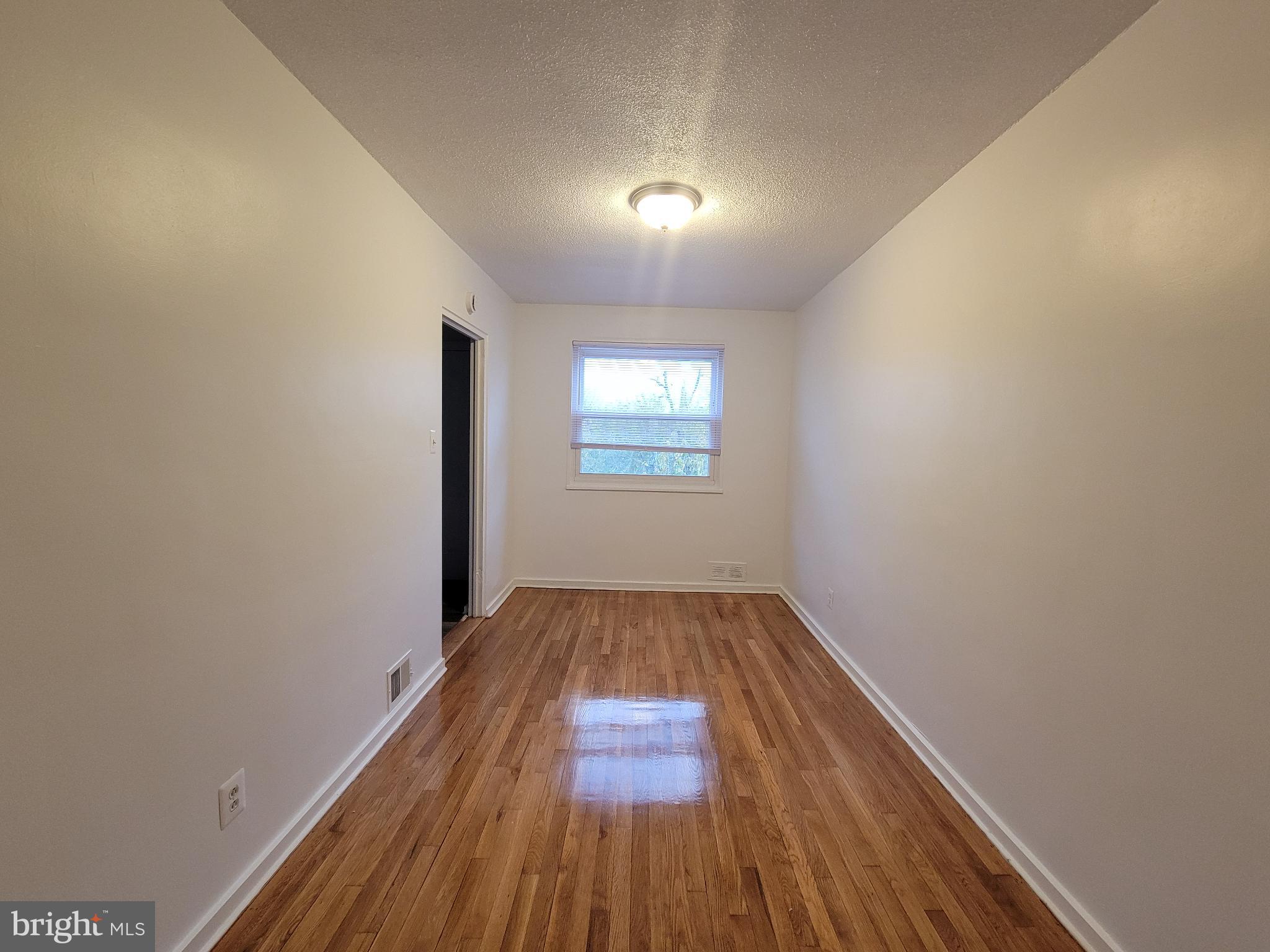 147 Mississippi Avenue Southeast Washington, DC 20032 - Photo 3 of 11 Beautiful dining room with polished floors.