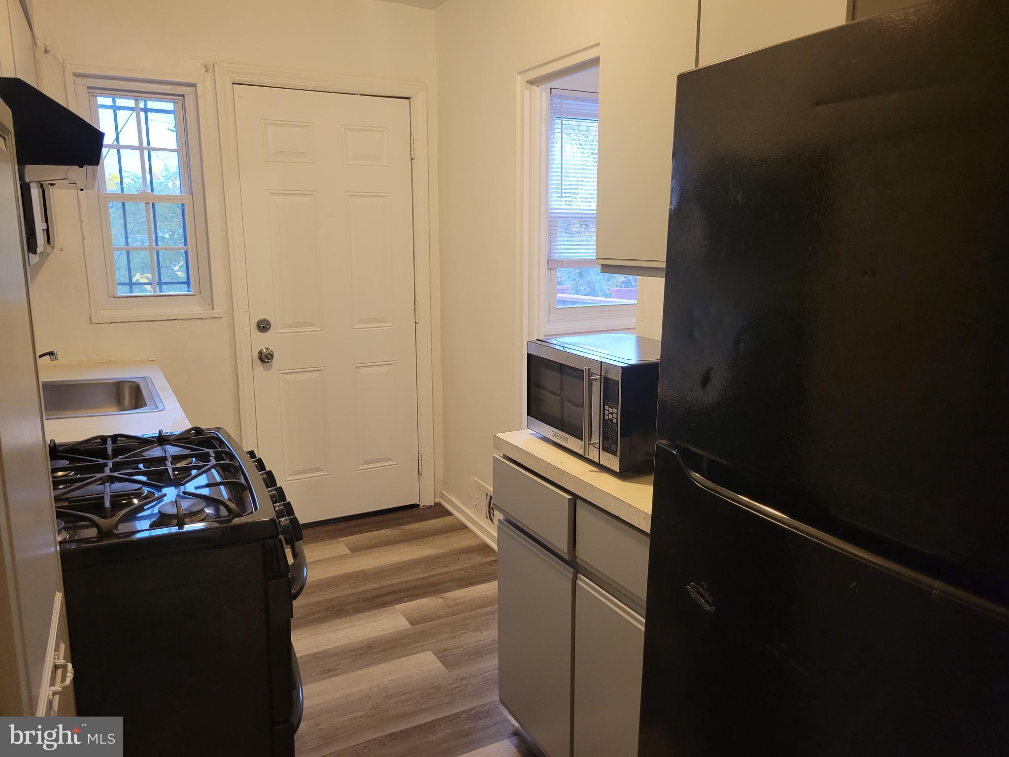 147 Mississippi Avenue Southeast Washington, DC 20032 - Photo 4 of 11 Cozy kitchen with modern appliances.