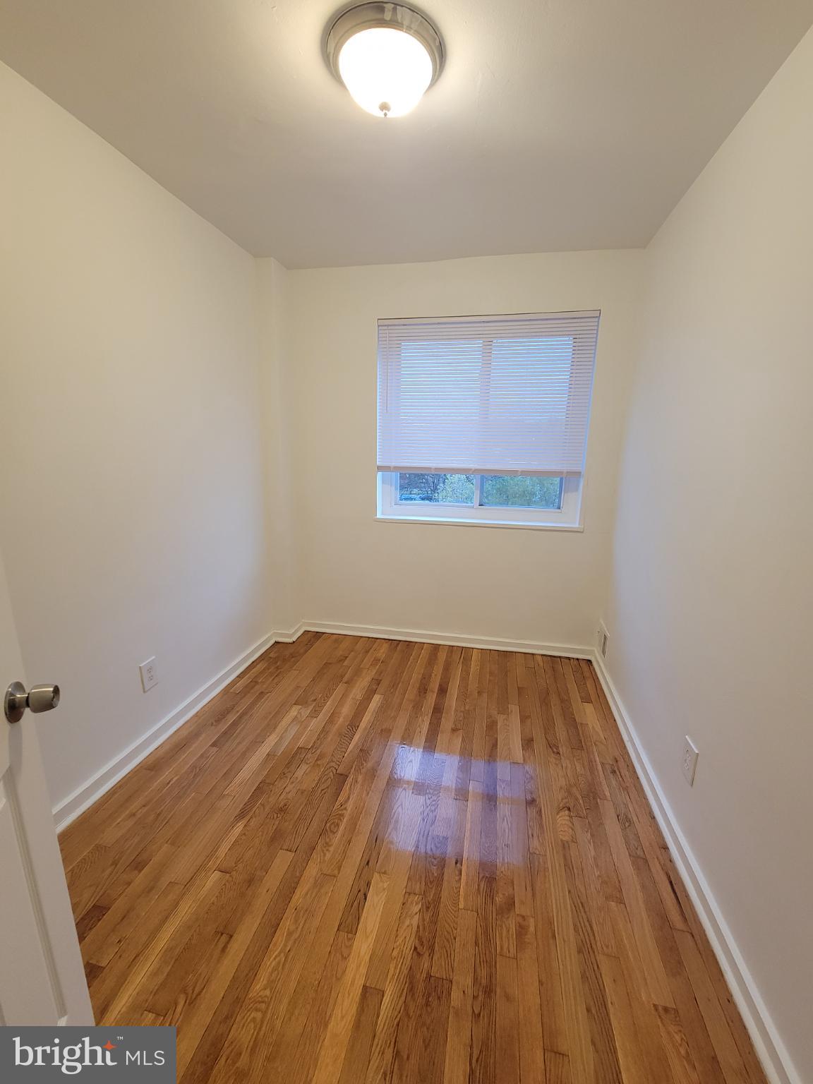 147 Mississippi Avenue Southeast Washington, DC 20032 - Photo 8 of 11 Bright and airy room bedroom with polished floors.