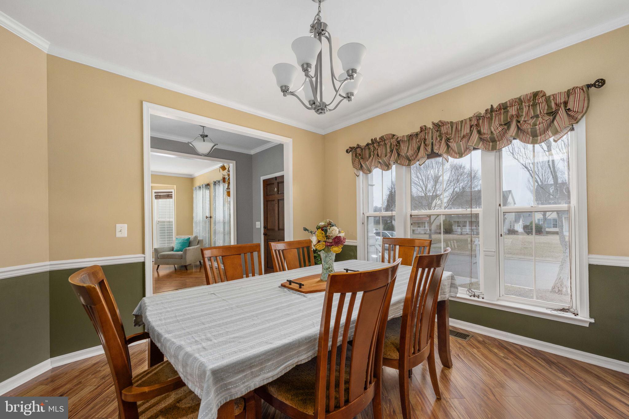 17230 Library Boulevard Ruther Glen, VA 22546 - Photo 12 of 81 a view of a dining room with furniture window and wooden floor