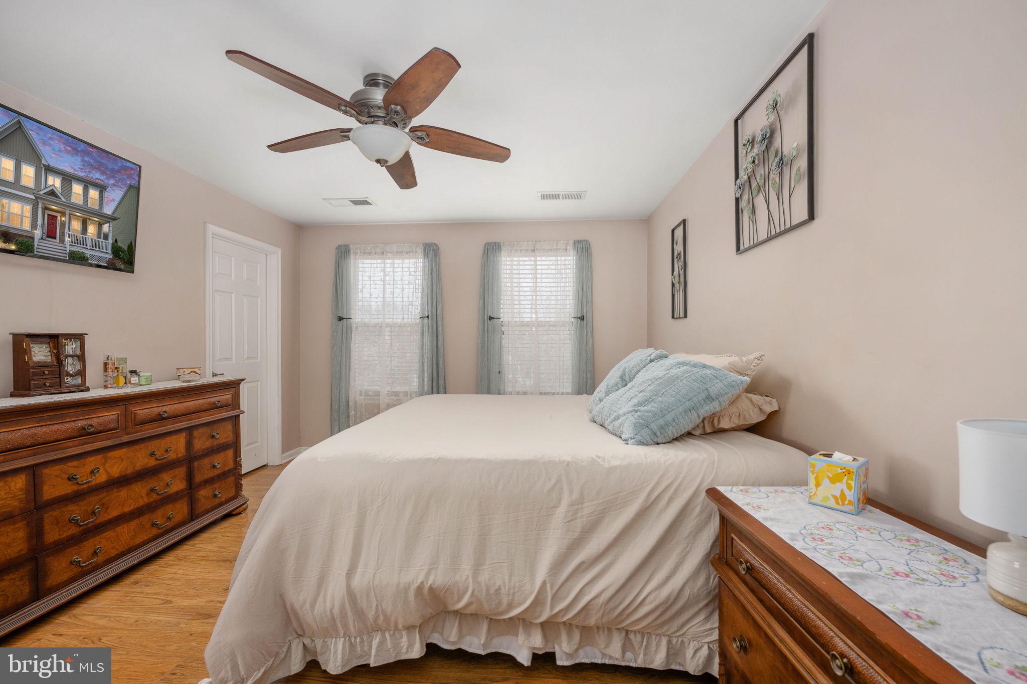 17230 Library Boulevard Ruther Glen, VA 22546 - Photo 38 of 81 a bedroom with a bed and ceiling fan
