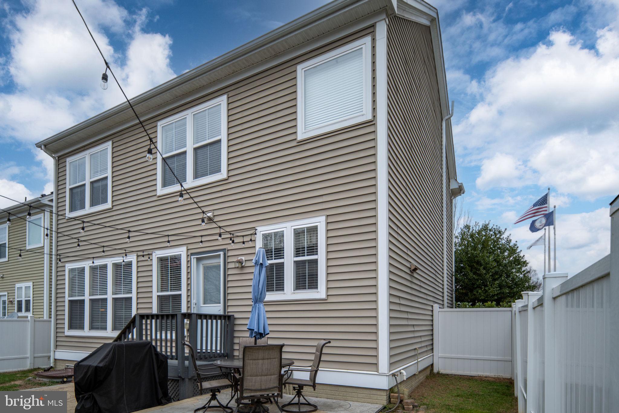 17230 Library Boulevard Ruther Glen, VA 22546 - Photo 69 of 81 a view of backyard with barbeque grill and wooden fence