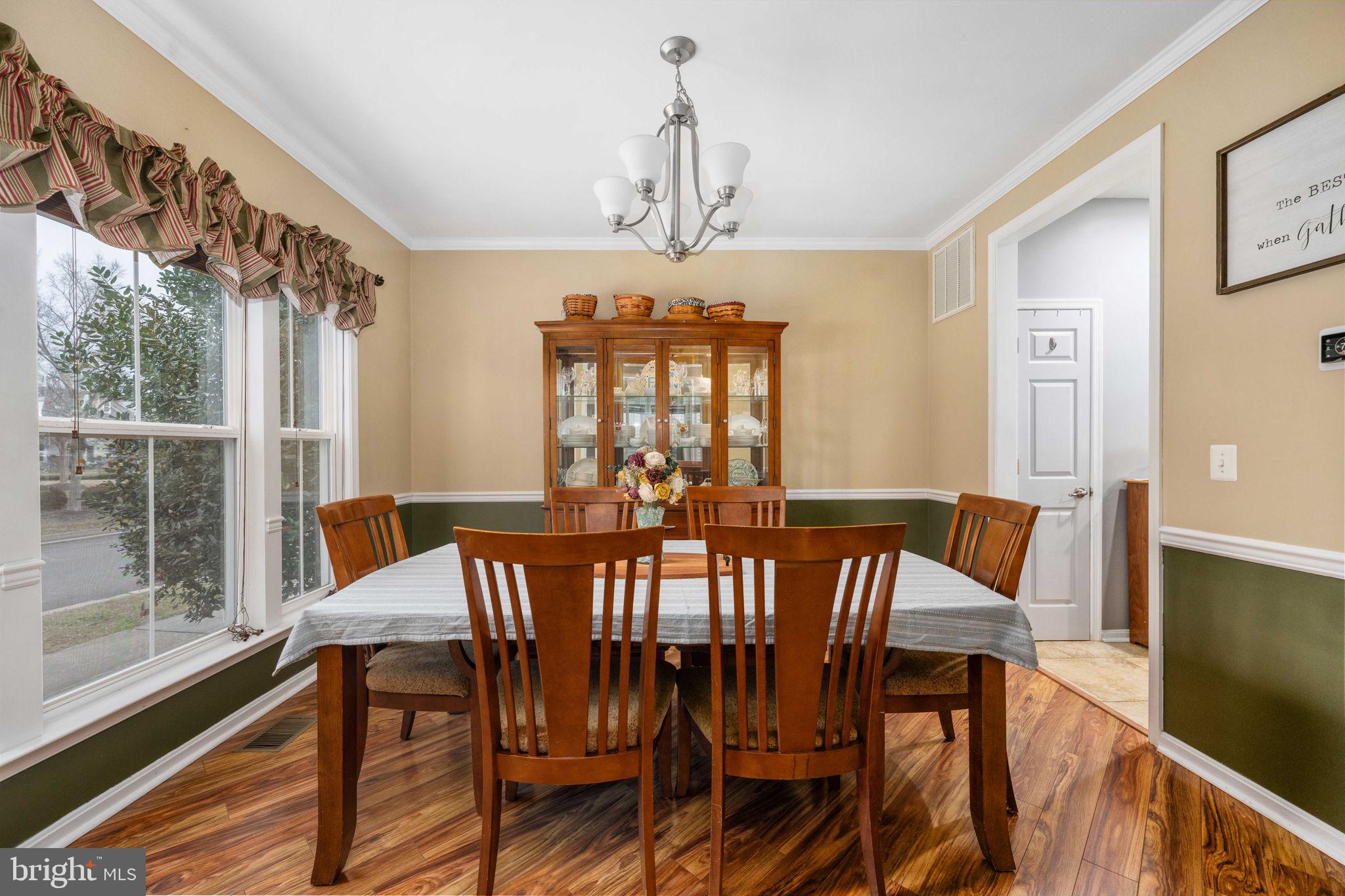 17230 Library Boulevard Ruther Glen, VA 22546 - Photo 10 of 81 a view of a dining room with furniture window and wooden floor