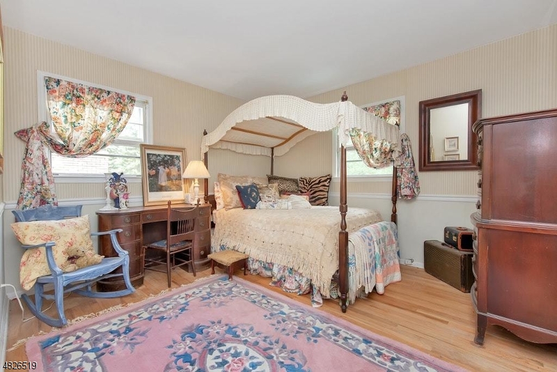 517 High Street Stirling, NJ 07980 - Photo 17 of 22 a bed room with a bed and a chair