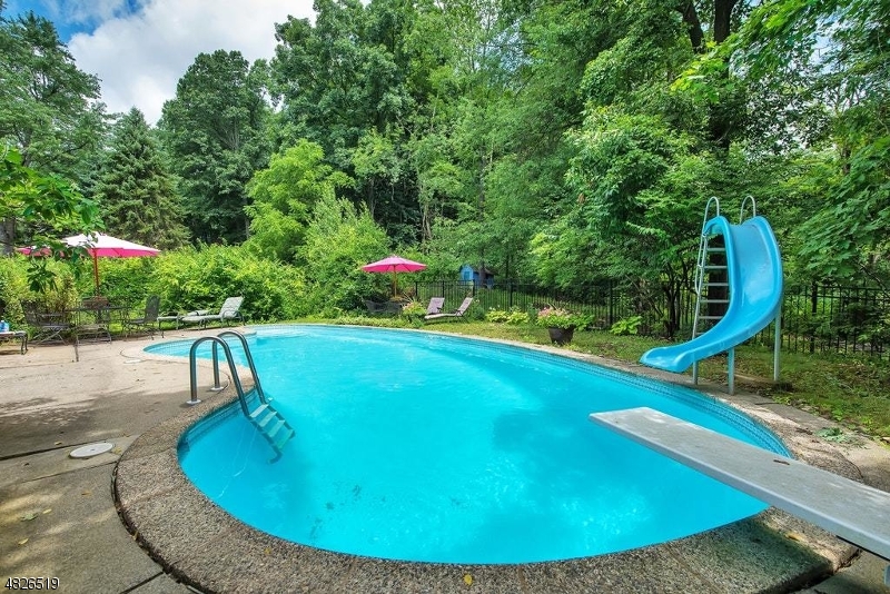 517 High Street Stirling, NJ 07980 - Photo 21 of 22 a view of a swimming pool with a yard and sitting area