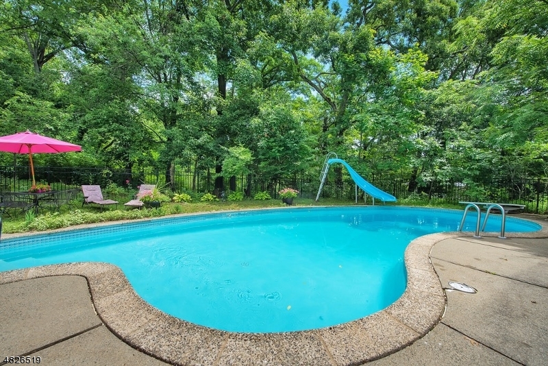 517 High Street Stirling, NJ 07980 - Photo 22 of 22 a view of a swimming pool with a patio