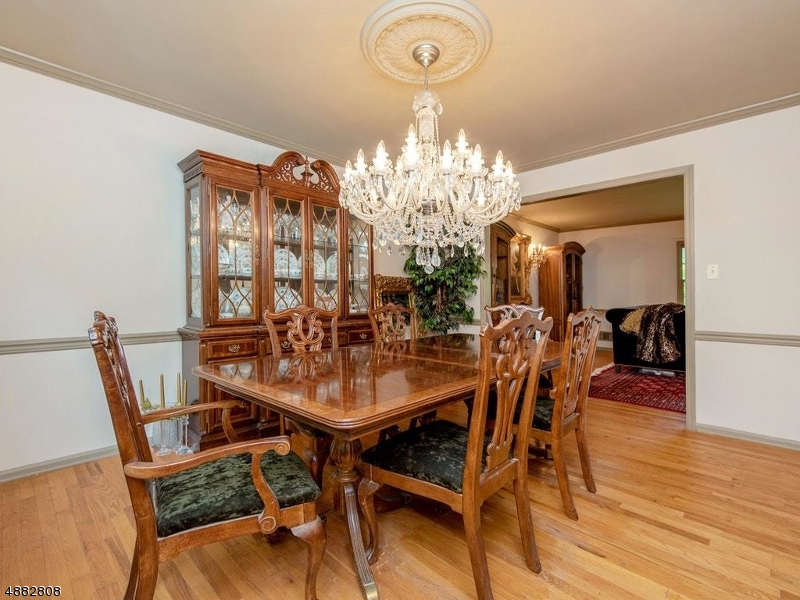 517 High Street Stirling, NJ 07980 - Photo 6 of 22 a view of a dining room with furniture and chandelier