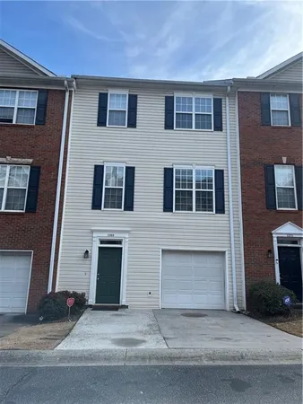 a front view of a house with yard
