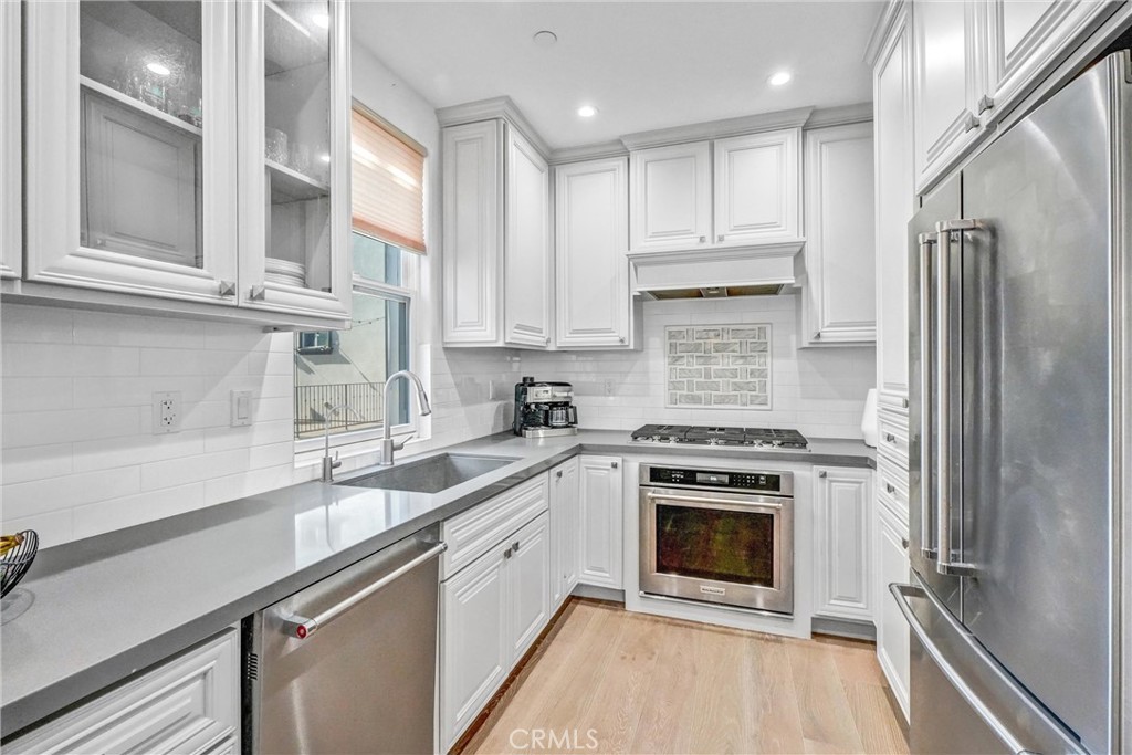 18228 Grevillea Avenue Redondo Beach, CA 90278 - Photo 13 of 39 a kitchen with a stove sink and refrigerator