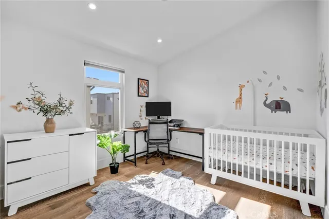 a bedroom with furniture and a window