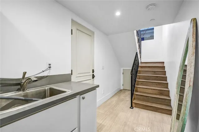 a kitchen with a sink and a refrigerator
