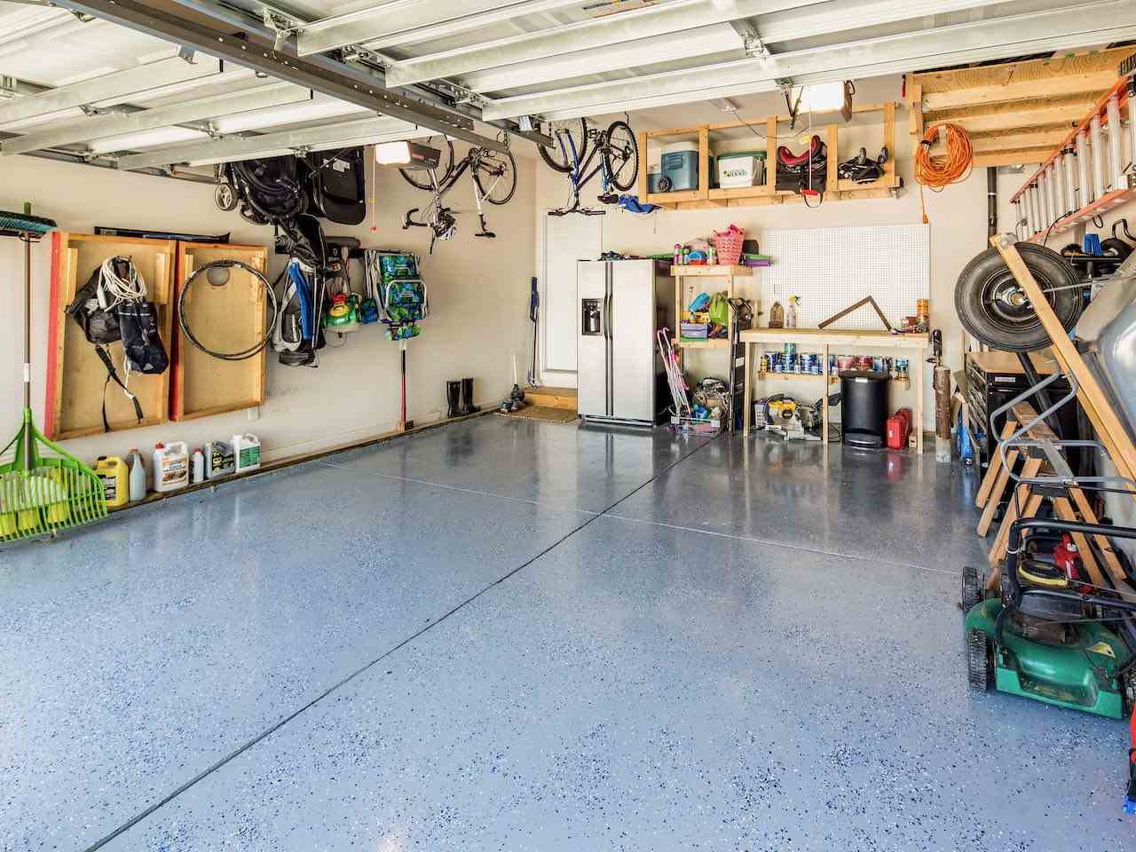 7780 Silver View Lane Raleigh, NC 27613 - Photo 24 of 30 Epoxy floor. Work bench. Built-in storage shelves. What's in your garage? Two-car garage