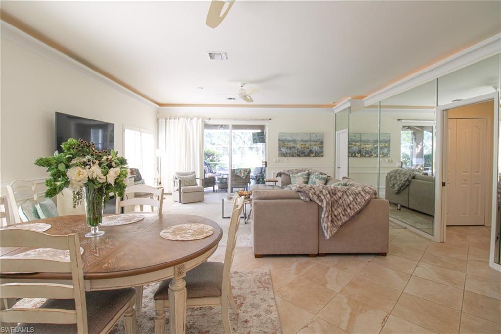 152 Napa Ridge Way Naples, FL 34119 - Photo 18 of 50 a living room with furniture and a large window