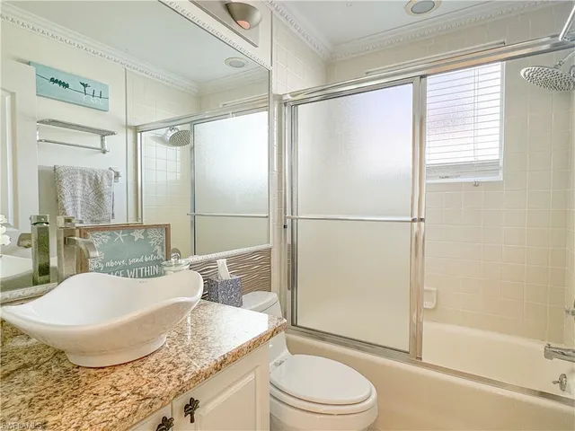 a living room with granite countertop furniture and a potted plant