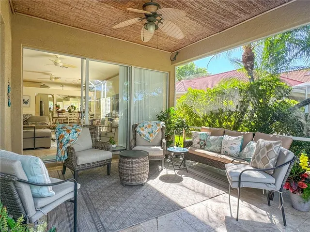 a view of a patio with couches chairs and a potted plant