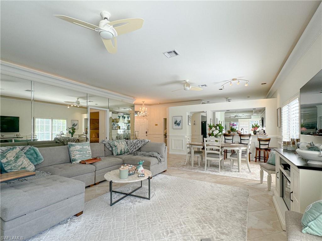 152 Napa Ridge Way Naples, FL 34119 - Photo 31 of 50 a living room with furniture and a large window