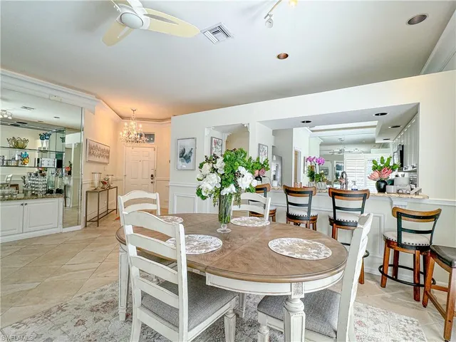 a bathroom with a bathtub sink and mirror