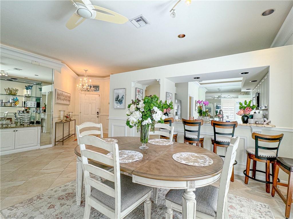 152 Napa Ridge Way Naples, FL 34119 - Photo 33 of 50 a view of a dining room with furniture