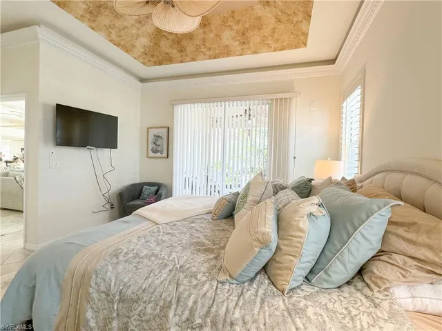 a bedroom with a bed and a lamp