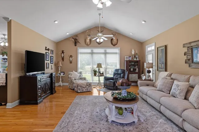 a bedroom with a bed a window and dresser