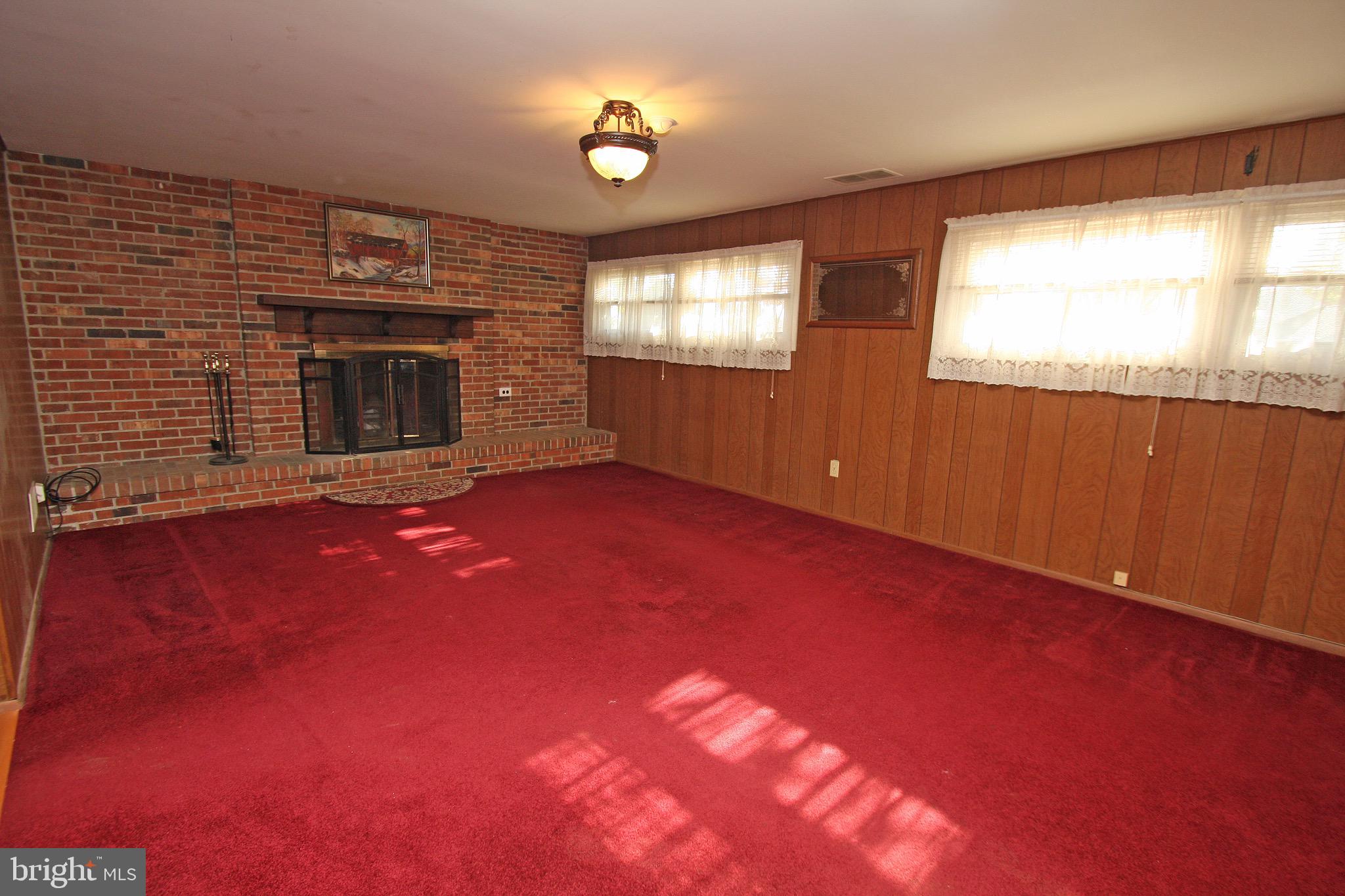20 Burns Road Claymont, DE 19703 - Photo 26 of 43 Recreation room with wood burning fireplace