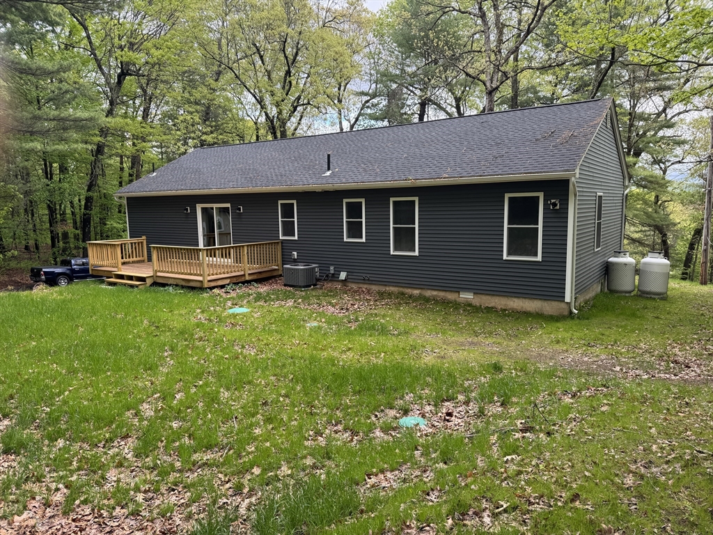 132 Kibbe Road East Longmeadow, MA 01028 - Photo 5 of 32 a front view of a house with garden