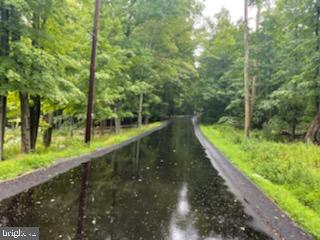 115 Falcon Crest Greentown, PA 18426 - Photo 4 of 7 a view of a lake with a large trees