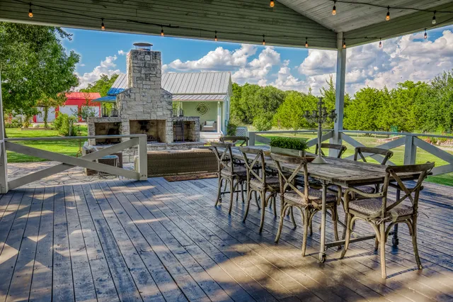 a view of an outdoor dining space with a patio
