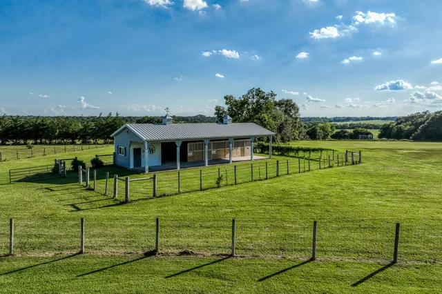 a view of a house with big yard